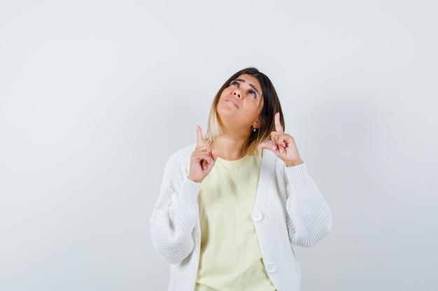 Young woman wearing a white cardigan