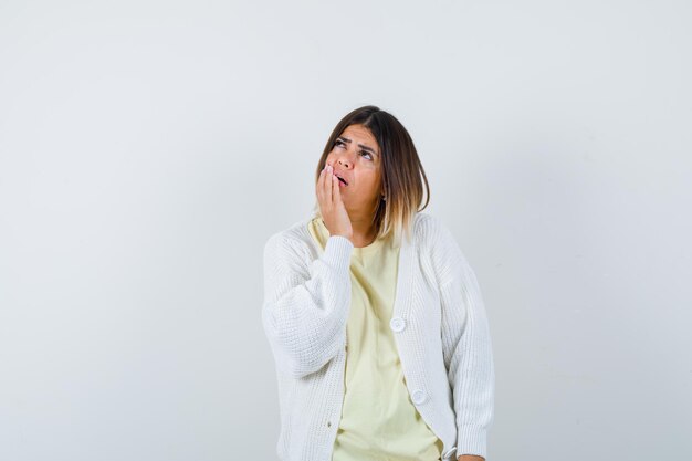 Young woman wearing a white cardigan