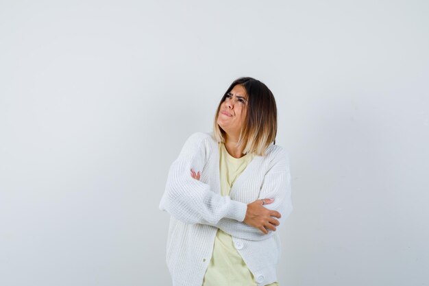 Young woman wearing a white cardigan