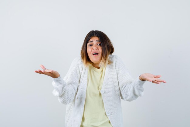 Young woman wearing a white cardigan