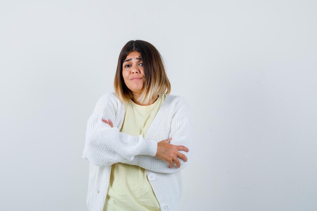 Young woman wearing a white cardigan