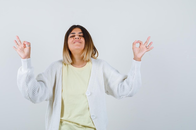 Young woman wearing a white cardigan