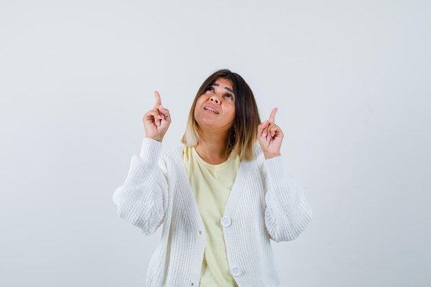 Young woman wearing a white cardigan