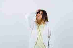 Free photo young woman wearing a white cardigan