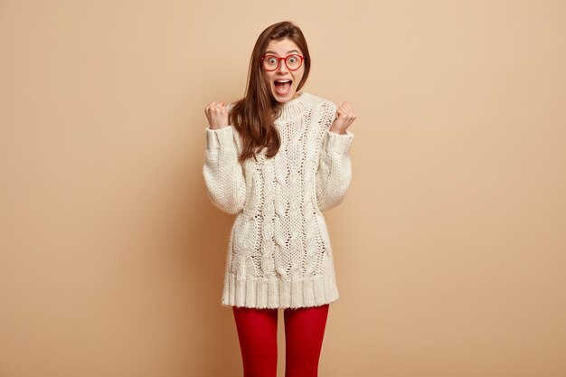 Young woman wearing white sweater