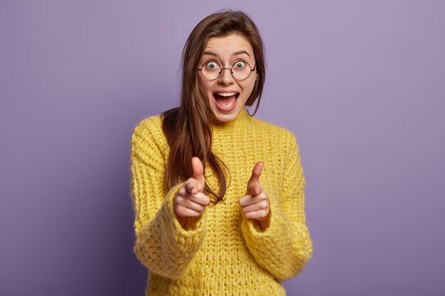 Young woman wearing yellow sweater