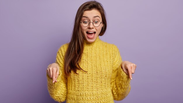 Young woman wearing yellow sweater