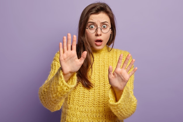 Young woman wearing yellow sweater