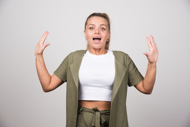 Young woman in white shirt felling surprised.