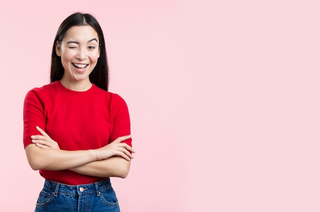 Free photo young woman winking at camer