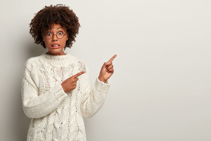 Free Photo young woman with afro haircut wearing white sweater