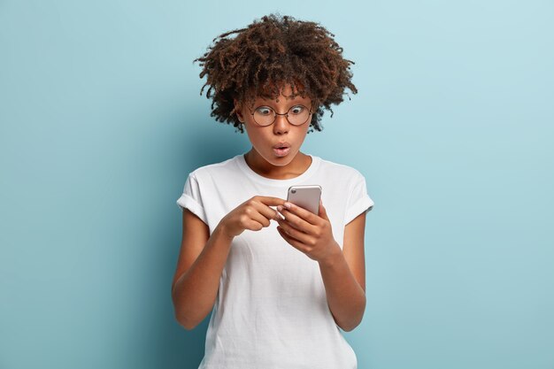 Young woman with Afro haircut wearing white T-shirt