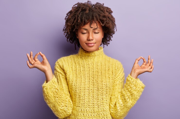 Free Photo young woman with afro haircut wearing yellow sweater