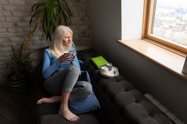 Young woman with albinism and coffee cup