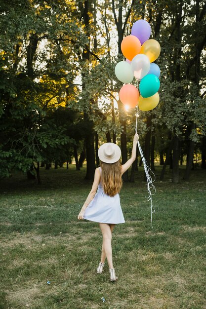 Young woman with balloons outdoor