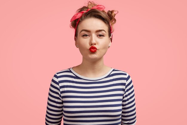 Young woman with bandana and striped shirt