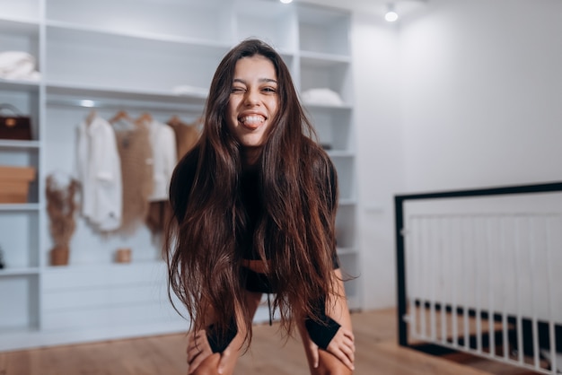 Young woman with beautiful slim healthy body posing