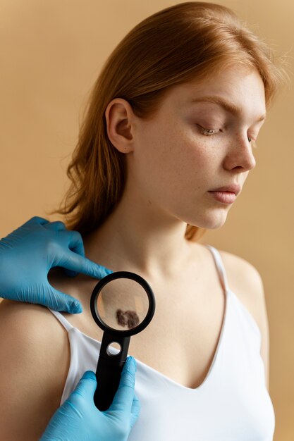 Young woman with big mole side view