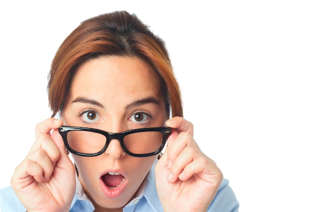 Young woman with black glasses looking surprised