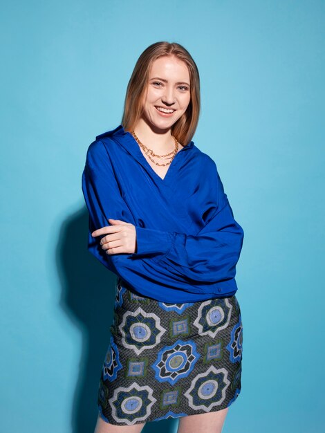 Young woman with chain necklace posing