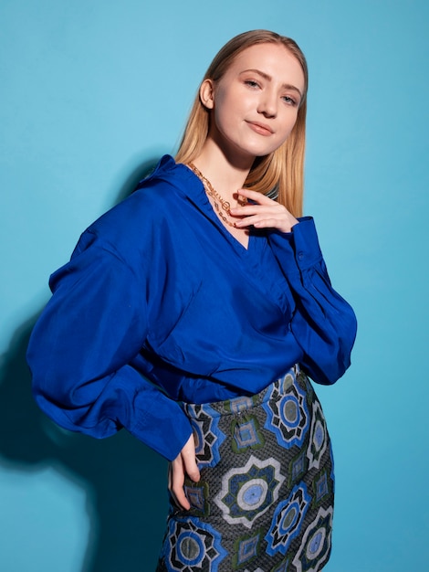 Young woman with chain necklace posing