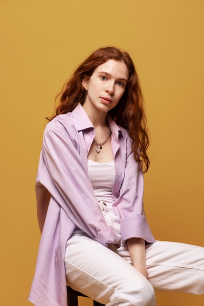 Young woman with chain necklace posing