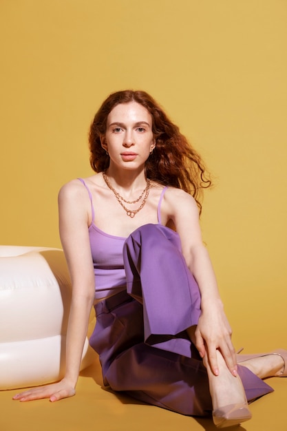 Young woman with chain necklace posing