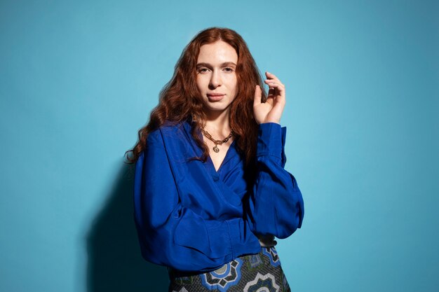 Young woman with chain necklace posing