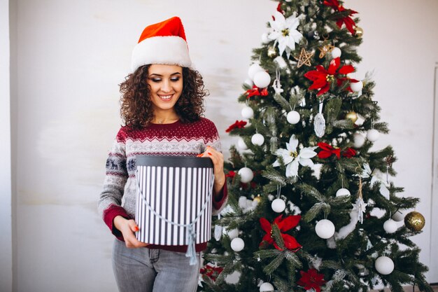 Young woman with christmas gifts