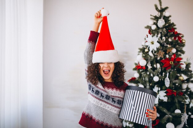 Young woman with christmas gifts