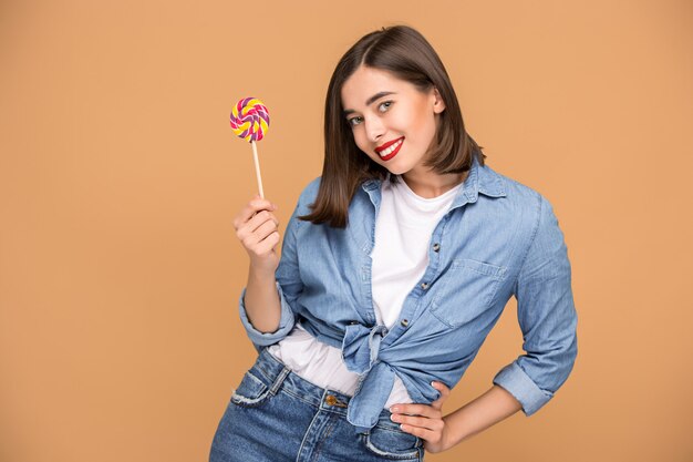 young woman with colorful lollipop