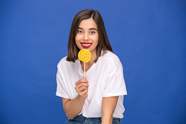 young woman with colorful lollipop