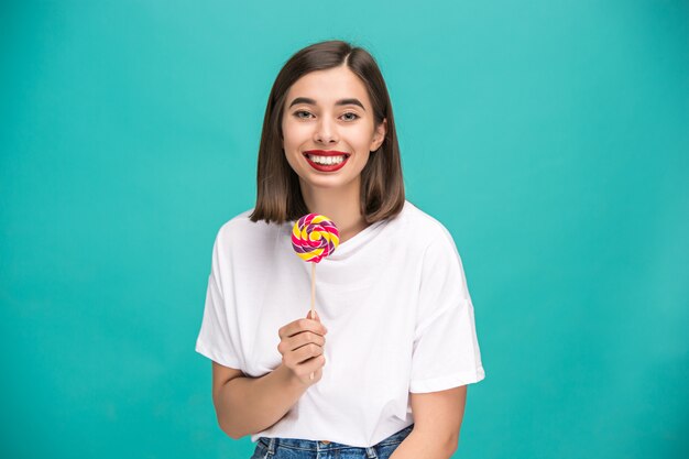 young woman with colorful lollipop