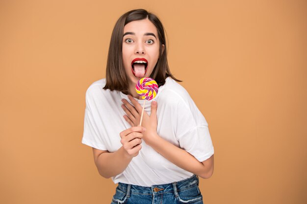 young woman with colorful lollipop