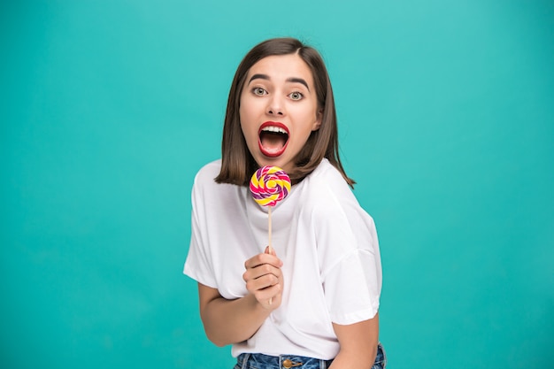 young woman with colorful lollipop