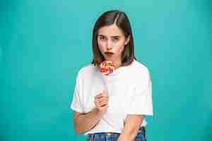 Free photo the young woman with colorful lollipop