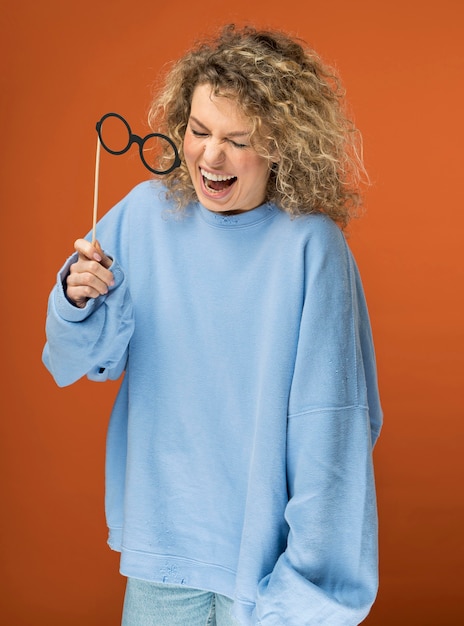 Young woman with curly blonde hair smiling