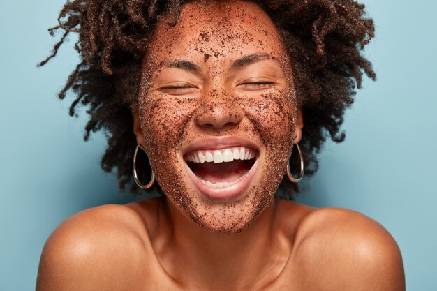 Young woman with curly hair with face mask