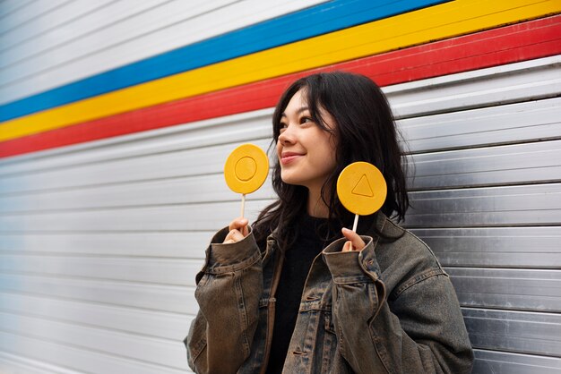 Young woman with dalgona cookie