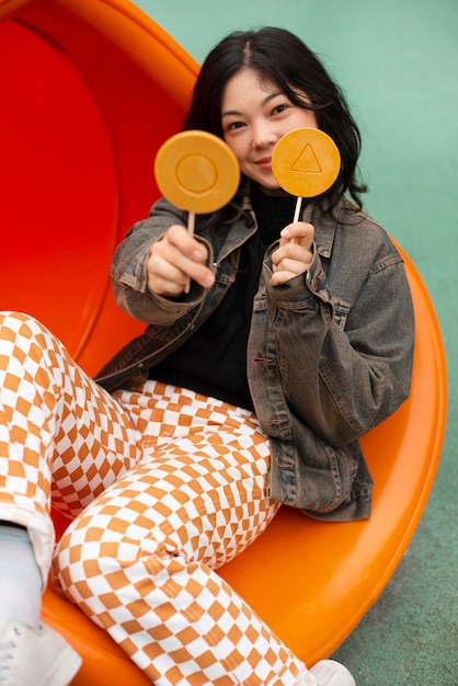 Young woman with dalgona cookie