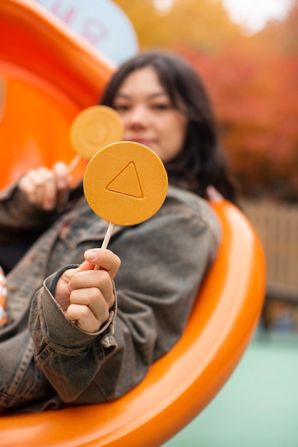 Free photo young woman with dalgona cookie