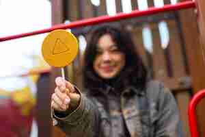 Free photo young woman with dalgona cookie