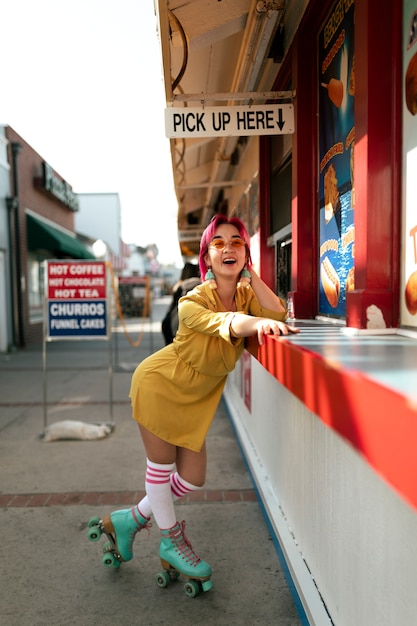 Young woman with dyed hair near shop