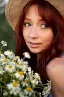 Free photo young woman with flower bouquet