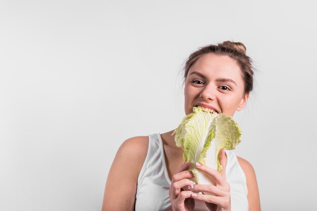 Young woman with fresh cabbage