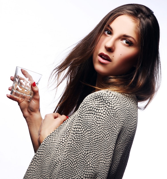 Young woman with glass in hand