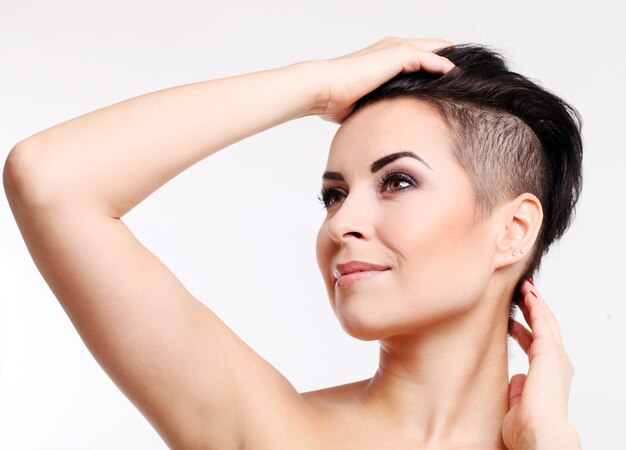 Young woman with haircut and evening makeup