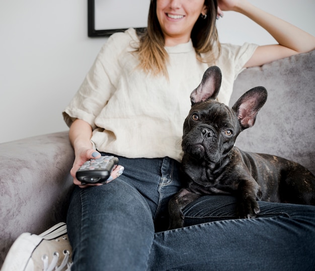 Young woman with her cute little puppy