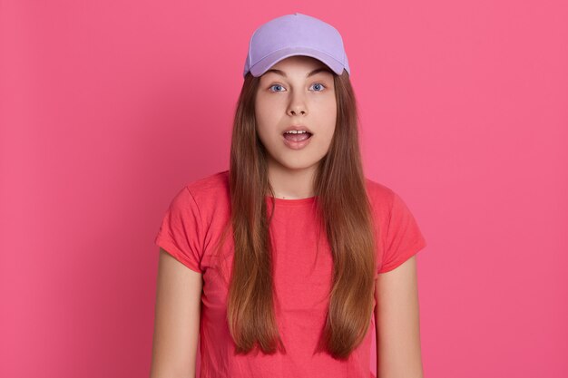 Young woman with her mouth open, posing