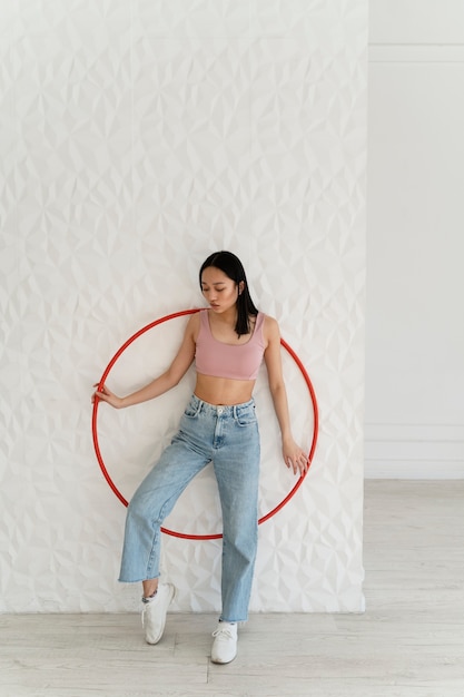 Young woman with hula hoop